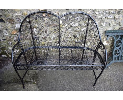 A black painted metal bench, 120cm wide x 90cm deep.Collection of this lot is strictly by appointment on Saturday 17th April 