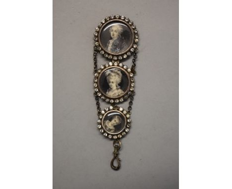 An antique chatelaine, inset with a graduated set of three portrait miniatures of Louis XVI, Marie Antoinette and Prince Loui
