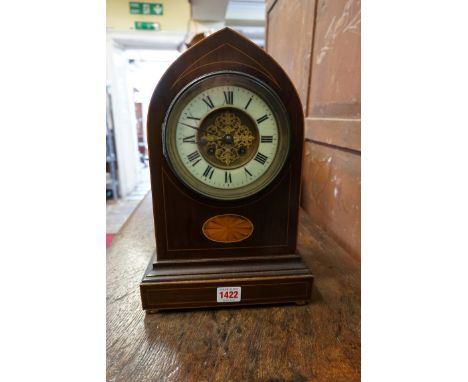 An early 20th century mahogany and inlaid lancet form mantel clock, 33.5cm high, with pendulum and winding key.&nbsp; 
