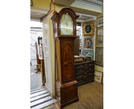 A good early 20th century figured walnut and crossbanded 8 day longcase clock,&nbsp;the elaborate 13in silvered and gilt bras