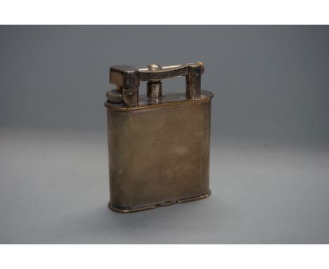 A vintage Dunhill electroplated 'Giant' table lighter,&nbsp;with engine turned decoration, 10.5cm high, (with presentation in