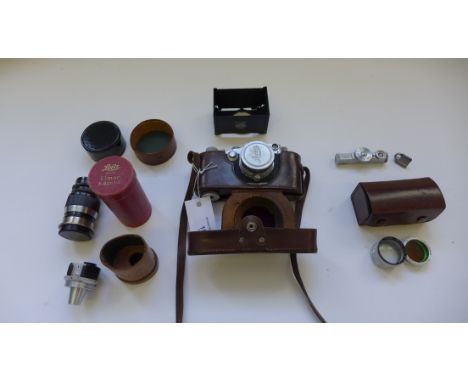 Leica 111c camera, c1950, chrome, serial number 374591 with a Leitz Summiter f=5cm lens (No. 559962), in original brown leath