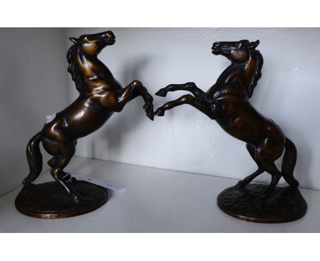 A pair of bronze rearing horse figures (2)