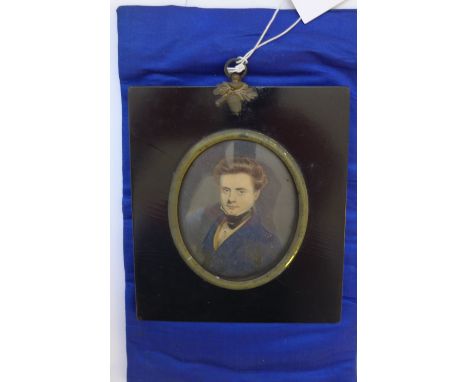 19th Century oval portrait miniature on card of a Young Captain, in ebonised frame.