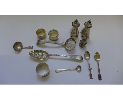 A collection of various 19th Century and later silver spoons to include a berry spoon, sifter, salt spoon, caddy spoon and ot