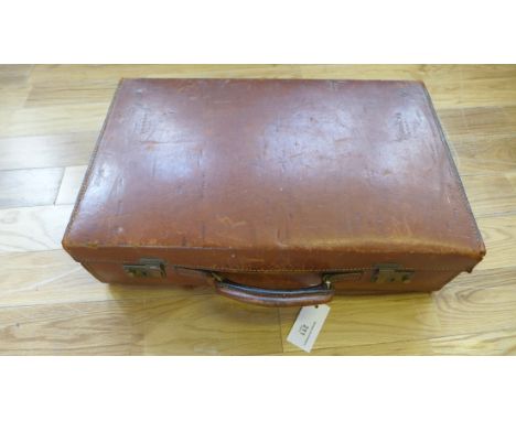 A vintage brown leather suitcase