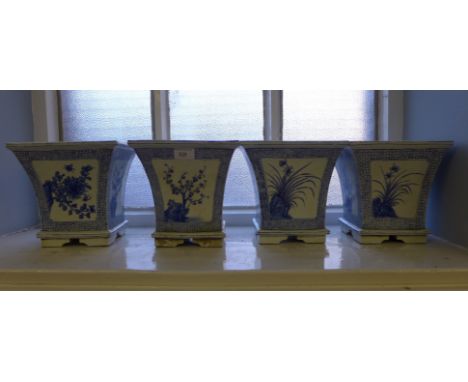 A collection of four late 19th century ceramic blue and white planter