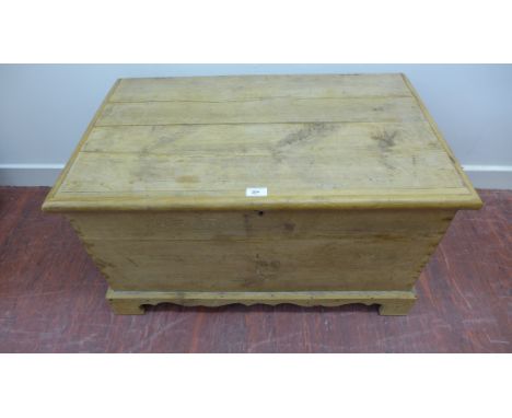 A pine blanket box having a moulded top and raised on bracket feet.  81 x 46cm