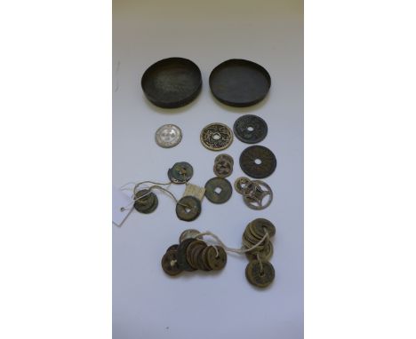 A collection of Chinese circular bronze coins to include seven Pan Liang, Han Dynasty coins, contained within a circular copp