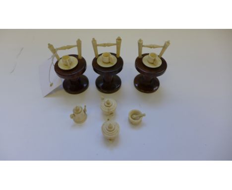 Late 19th / Early 20th Century miniature ivory teawares to include two teapots, hot water pot, three cups, three saucers, a b