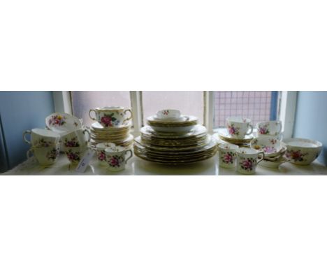 An extensive collection of Royal Crown Derby 'Derby Posies' pattern dinner and tea wares to include plates, side plates, bowl