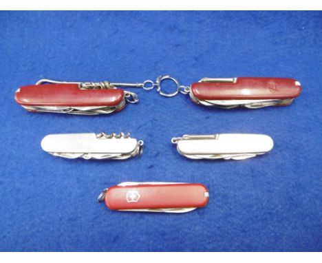 FIVE SWISS ARMY KNIVES INCLUDING MERCEDES ETC