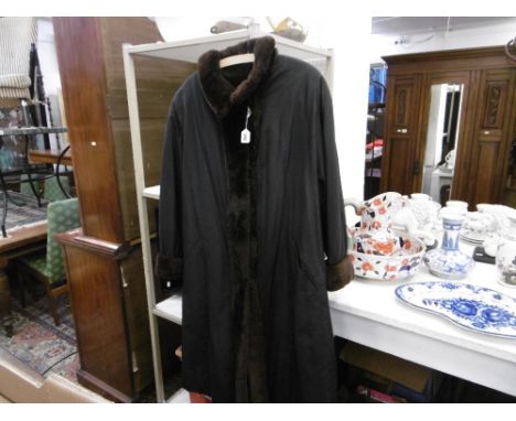 A BEAVER LINED COAT SIZE 18/20
