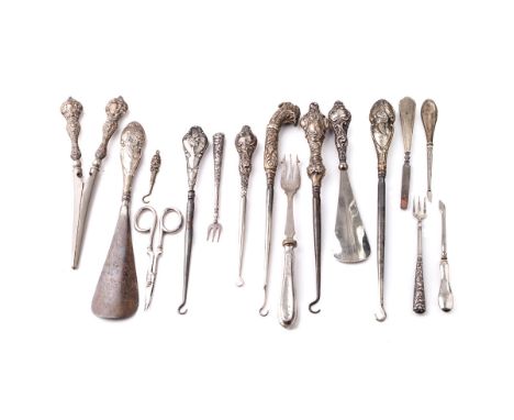 A good collection of silver-handled items to include scissors, knives, button hooks etc (Qty).  