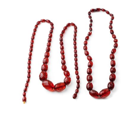 A pair of vintage bakelite cherry amber (or similar) graduated necklaces with faceted beads, longest 71cm long, total weight 