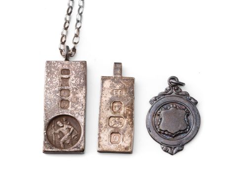 A pair of silver ingots, one on chain, together with a silver fob, 59.8 grams (3).  