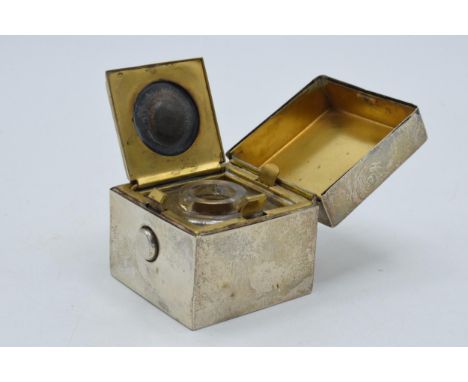 Silver travelling inkwell in cube form, Birmingham 1909, GY &amp; Co, with glass liner, 5cm tall.  Slight bending to lid.