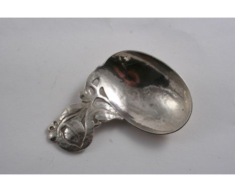 AN EARLY 20TH CENTURY HANDMADE CADDY SPOON with an openwork, leafy handle and an offset oval bowl, by Bernard Instone 1927;  