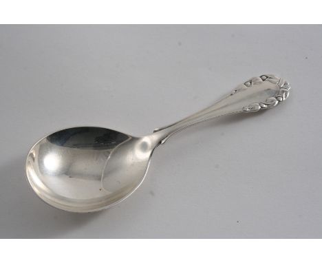 A MODERN DANISH ROSE PATTERN CADDY SPOON with English import marks for London 1928; 4.4"  (11 cms) long;  0.75 oz