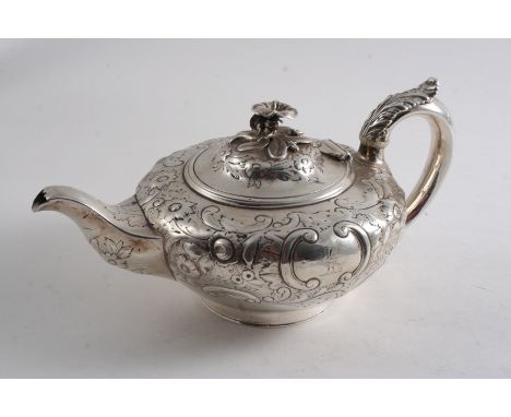 AN EARLY VICTORIAN TEA POT circular with embossed decoration, a ring foot & a flower finial, crested, by John Wrangham & Will