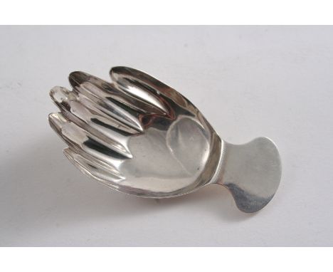 A GEORGE III CADDY SPOON in the form of a right hand with lug handle, by Josiah Snatt, London 1804; 2.75" (7 cms) long;  0.25