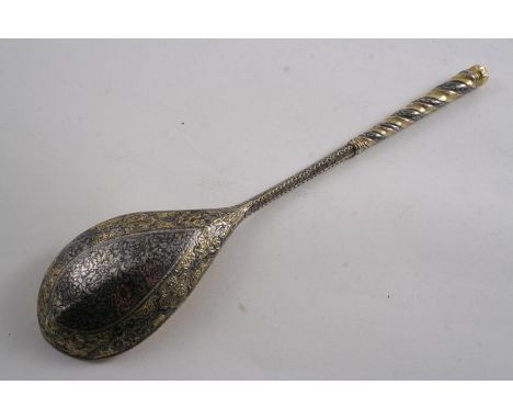 A 19TH CENTURY RUSSIAN PROVINCIAL / CAUCASIAN SPOON with parcelgilt & niellowork decoration, a drop-shaped bowl & a coronet f