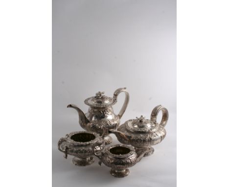 A GEORGE IV EMBOSSED FOUR-PIECE TEA & COFFEE SERVICE with floral & foliate decoration & vacant cartouches, the rims cast with