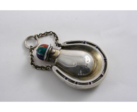 A VICTORIAN NOVELTY, SILVERGILT & ENAMELLED SCENT BOTTLE on a horse-racing theme with a button-operated, jockey cap cover & a