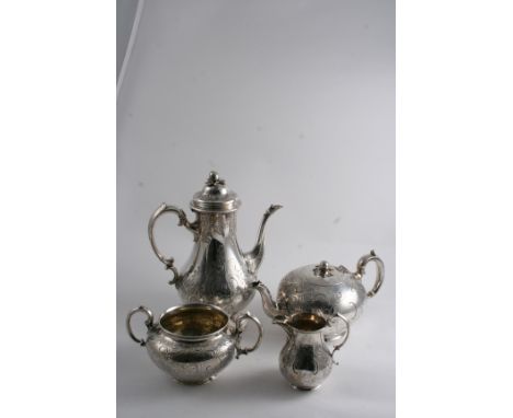 A VICTORIAN COFFEE POT with chased scroll work & a melon finial by Messrs. E.J. & W. Barnard, London 1849 and  a three-piece 