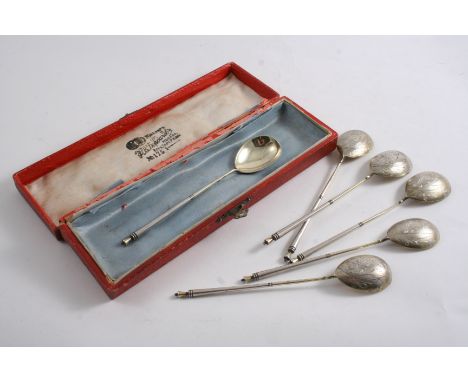 A SET OF SIX LATE 19TH / EARLY 20TH CENTURY RUSSIAN PARCEL GILT LEMON TEA SPOONS with Art Nouveau flowers engraved on the bac