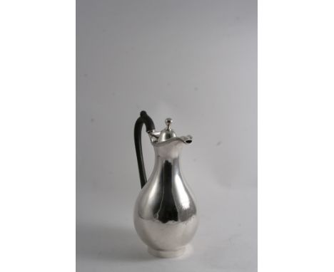 BY PAUL STORR: A George III baluster hot water jug on a collet foot, with a scroll handle, domed cover & ball finial, engrave