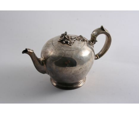 AN EARLY VICTORIAN SMALL BULLET TEA POT on a moulded foot with a c-scroll handle & a flower finial, by Messrs. Barnard, Londo