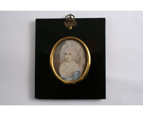 ENGLISH SCHOOL LATE 18TH CENTURY A miniature portrait of a lady with elaborately dressed hair, half length on ivory;  6 x 5 c