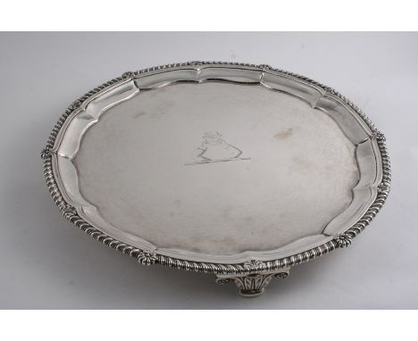 BY PAUL STORR: A George III salver of circular outline with a border of gadrooning, interspersed by shell & foliate motifs, o
