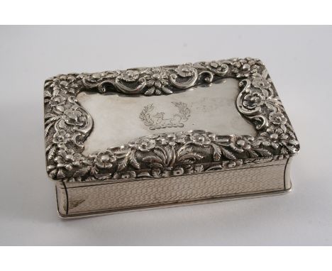 A WILLIAM IV ENGINE-TURNED SNUFF BOX oblong with slightly concaved sides and a large, raised floral border around the cover, 
