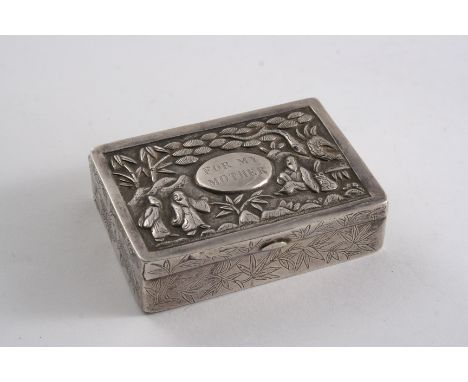 A 19TH CENTURY CHINESE OBLONG SNUFF BOX chased around the sides with bamboo foliage, the cover decorated in relief with figur