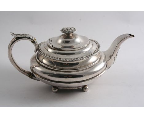 A GEORGE IV PROVINCIAL TEA POT oval with a tongue & dart border, knop finial, a c-scroll handle & ball feet, by John Walton, 