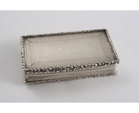 A WILLIAM IV ENGINE-TURNED SNUFF BOX with reeded sides, raised borders & a vacant rectangular area on the cover, gilt interio