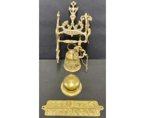 A brass counter bell, Bell's Scotch Whisky, LVNH Presidential Year 1986; a cast brass shop bell; a brass sign "Our Beers Rott