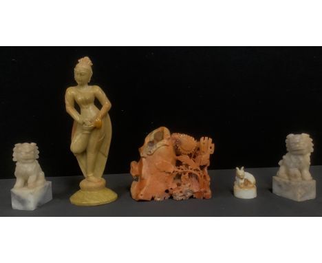 A pair of Chinese carved soapstone Dogs of Fo, 11cm; a Chinese carved soapstone temple lion seal, 5.5cm; a soapstone dancer; 