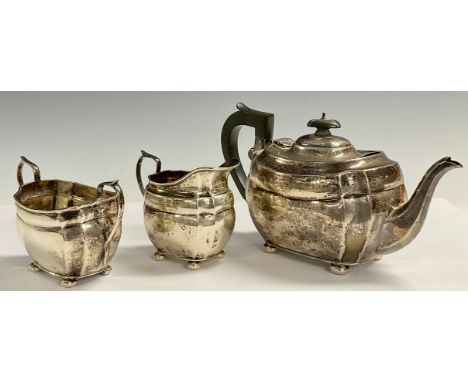 A George V silver three piece boat shaped tea service, Chester 1929, 23ozt