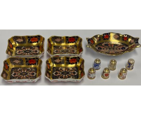 A Royal Crown Derby Imari 1128 pattern rectangular trinket dish, solid gold band, 9.5cm wide; three others; an 1128 shaped re