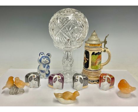 A cut glass table lamp; a Olympics Moscow 1980 model bear; a German beer stein; onyx animal and bird models; two Sri Lankan s