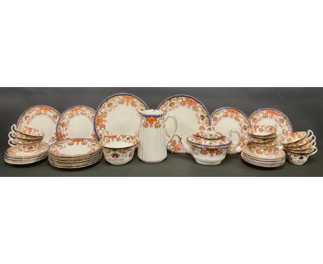 A Staffordshire Imari palette tea set, including teapot, hot water jug and slop bowl, pair of bread and butter plates, eleven