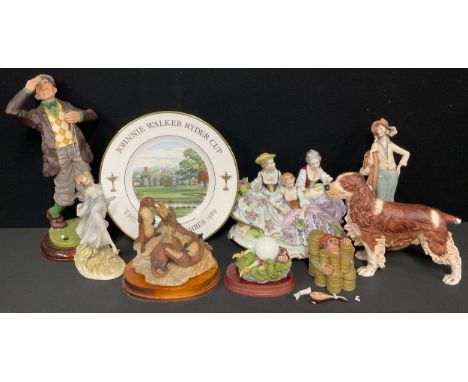 A Goebel model of a springer spaniel, 18cm high; a Wedgwood Ryder Cup commemorative plate 1989; a resin novelty golfer figure