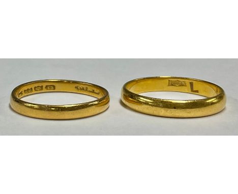 A 22ct gold wedding band, size L, 2.5g; a 22ct gold wedding band, size K, 2g (2)