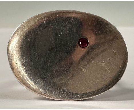 A Georg Jensen Torun silver ring, number 187, set with a single red stone, marked 925 with import marks for Birmingham, ring 