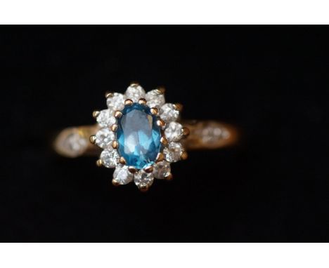 9ct Gold ring set with aquamarine &amp; clear stones Size M