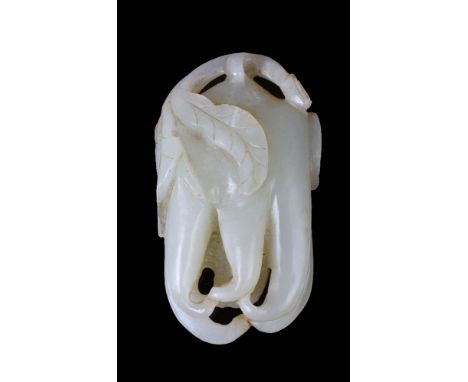 A Chinese white jade carving of a finger citron, Qing Dynasty, naturalistically carved to imitate a fruit with curled finger-