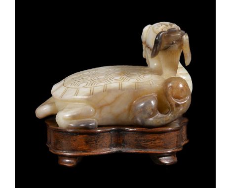 A Chinese jade white and brown turtle, late 19th or early 20th century, with dragon head, incised details to back and head, 7